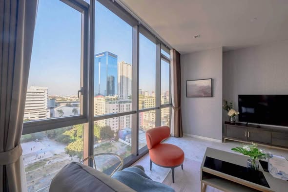 bedroom and living room of The Monument Thong Lo