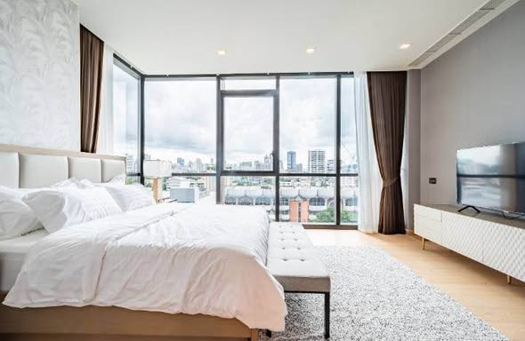bedroom and living room of The Monument Thong Lo