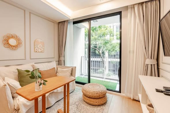 bedroom and living room of The Nest Ploenchit