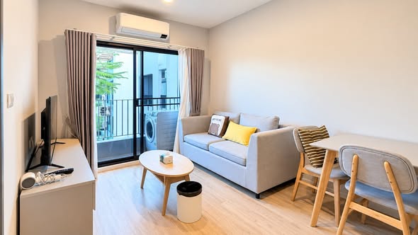 bedroom and living room of The Next Ruamchok – City Hall