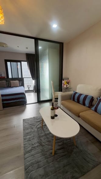 bedroom and living room of The Politan Rive