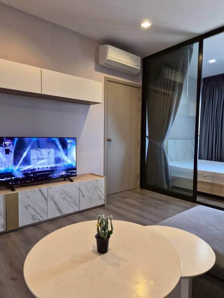bedroom and living room of The Politan Rive