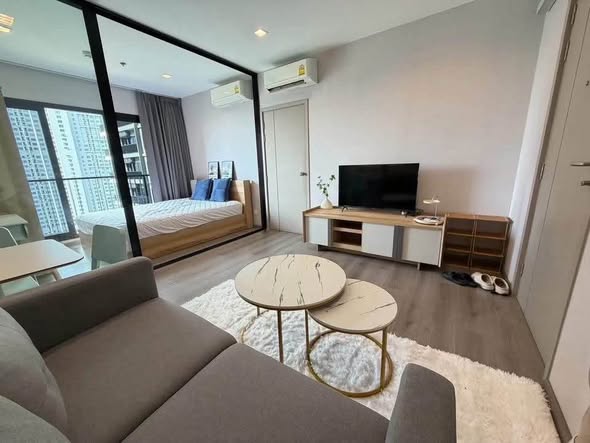 bedroom and living room of The Politan Rive