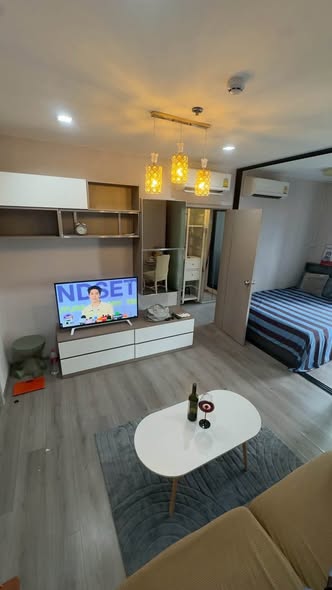 living room and bedroom of The Politan Rive