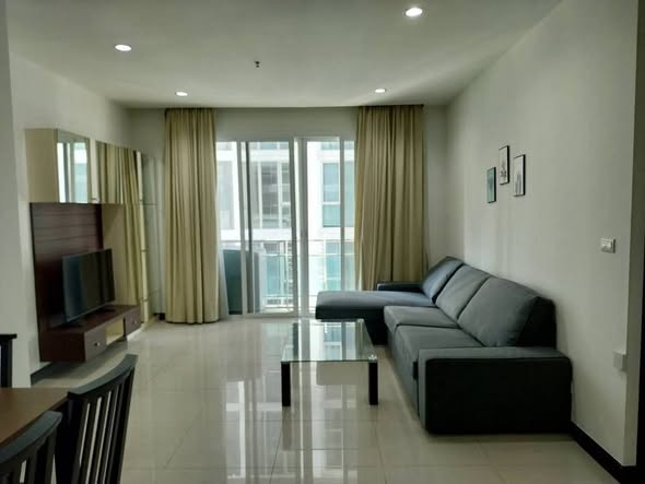 bedroom and living room of The Prime 11 Condo
