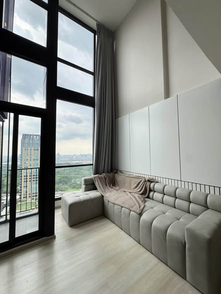 bedroom and living room of The Privacy Jatujak