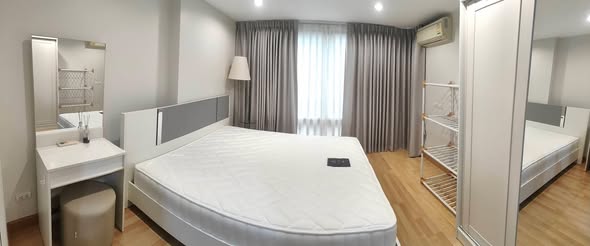 bedroom of The Raffles Condominium