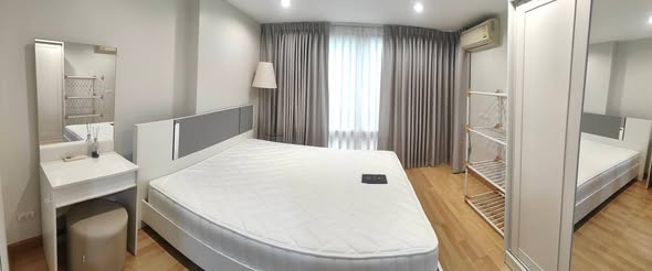 bedroom of The Raffles Condominium