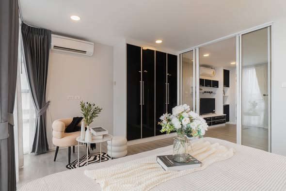 bedroom and room interior of The Raffles Condominium