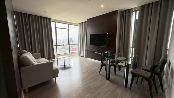 living room and bedroom of The Room Rama 4