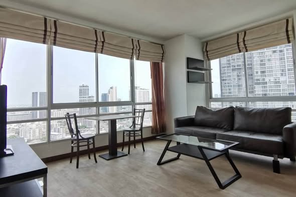 bedroom and living room of The Zest Condominium