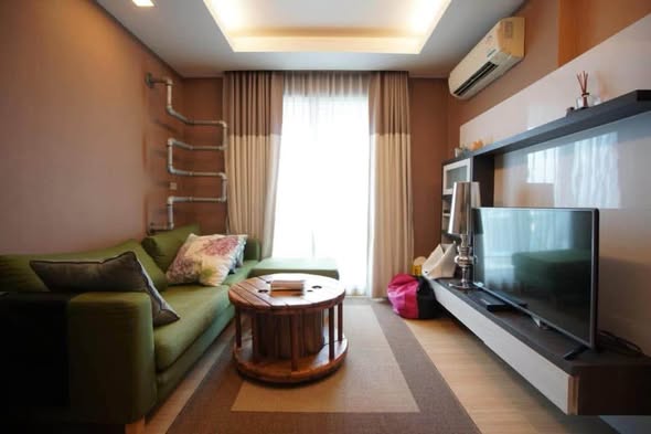living room and bedroom of Thru Thong Lor