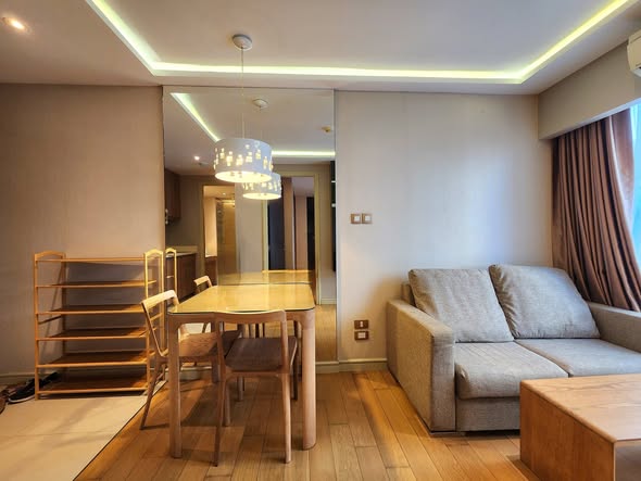 living room and bedroom of Tidy Deluxe Condominium