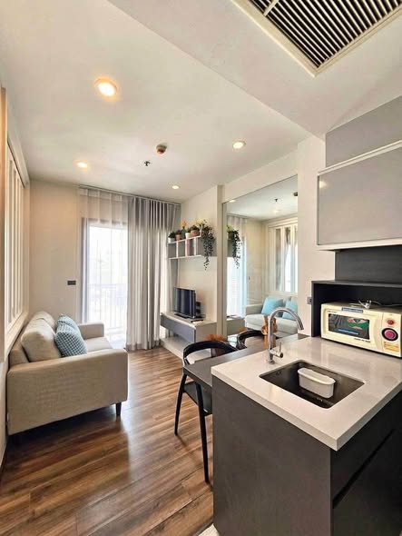 living room and kitchen of WYNE by Sansiri